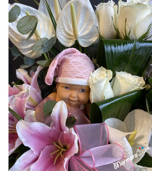Birth congratulations flower in a basket
